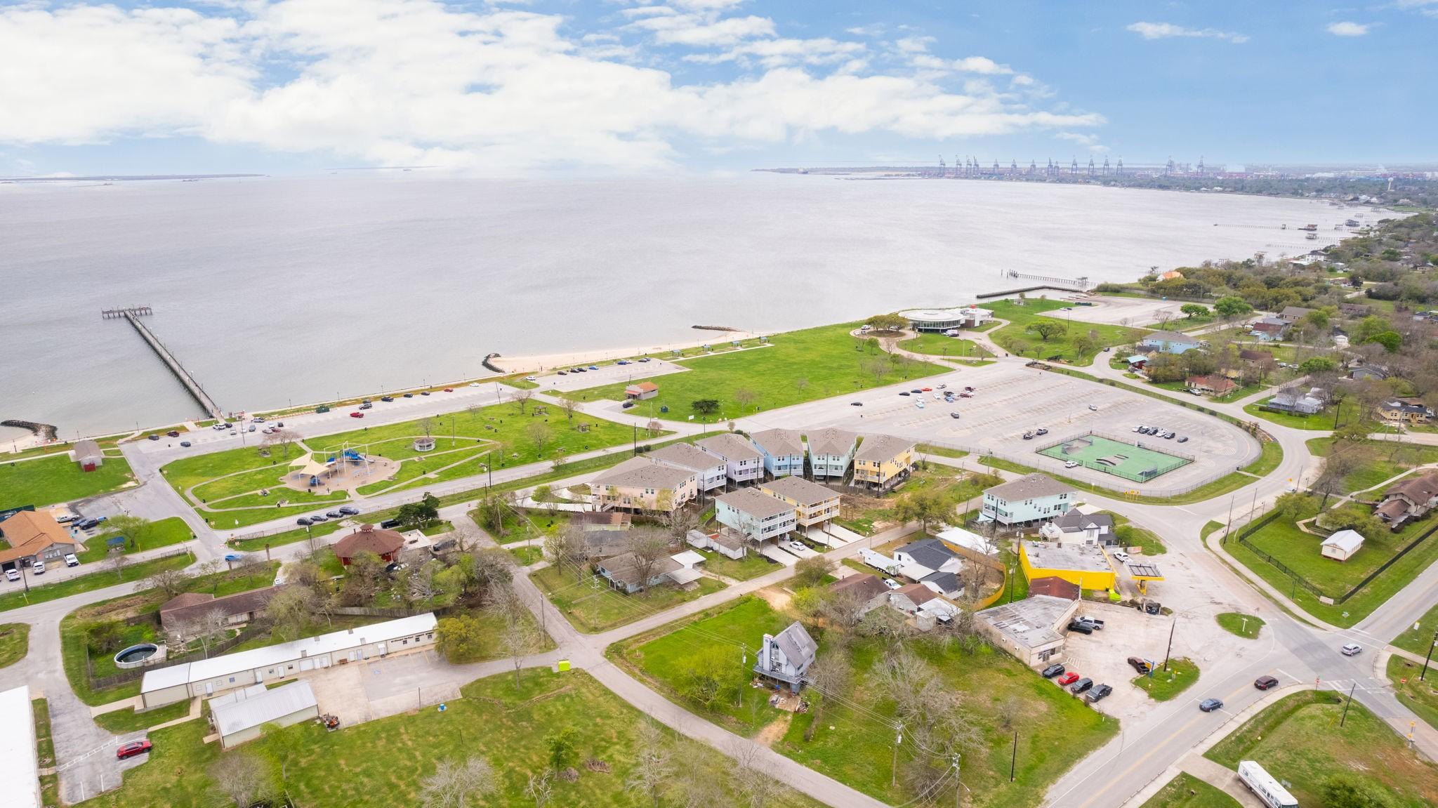 Image 4: This aerial photo shows a coastal neighborhood wit