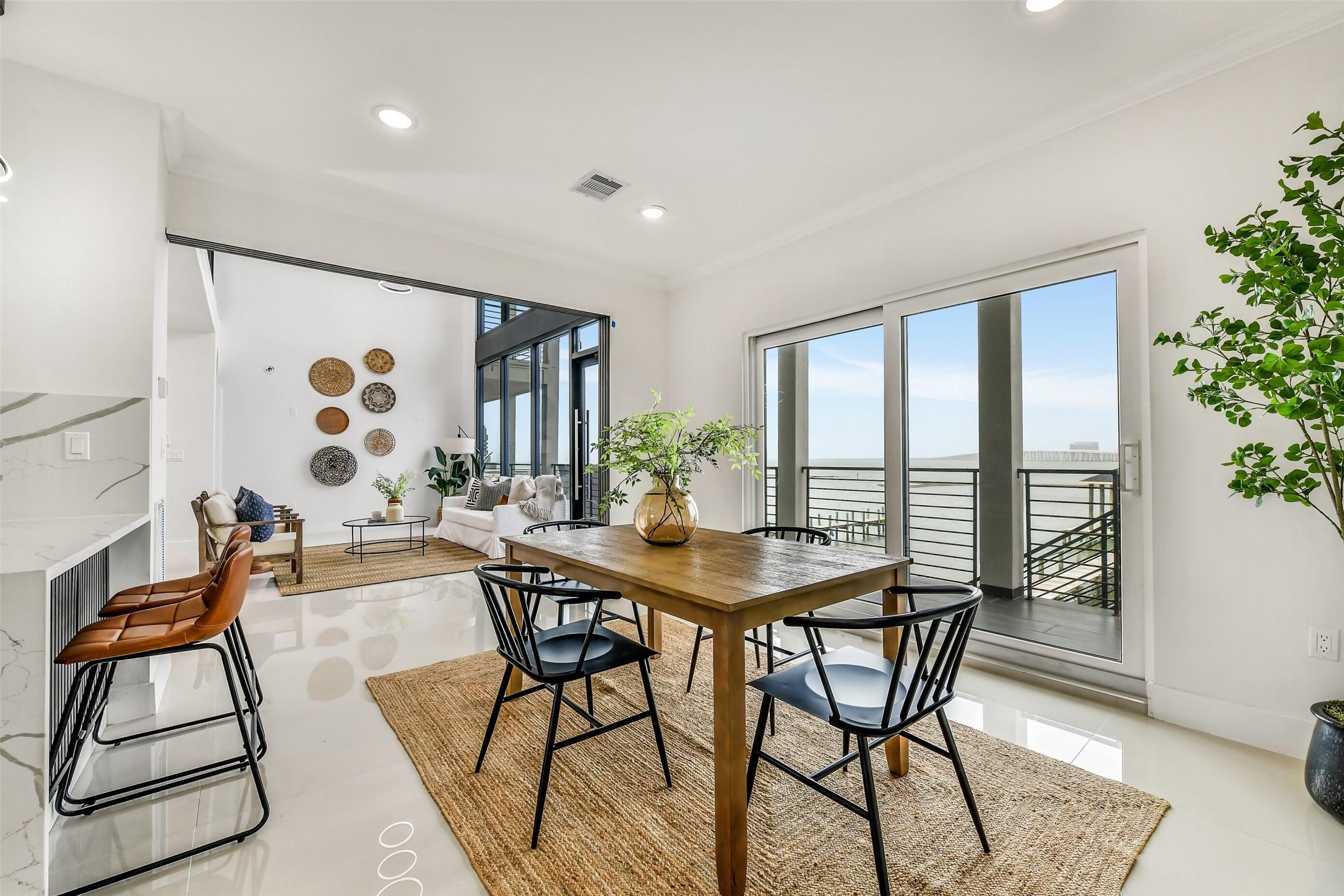 Image 4: Sunlight and water views elevate every gathering.