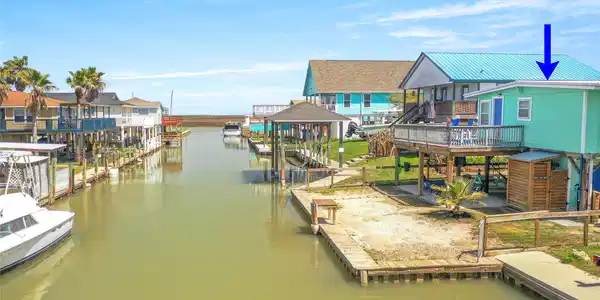 Image 2: Canal-front living with direct boat access to the