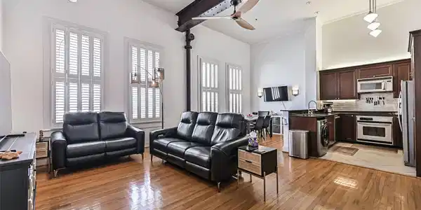 Image 4: The open-concept layout connects the living room,