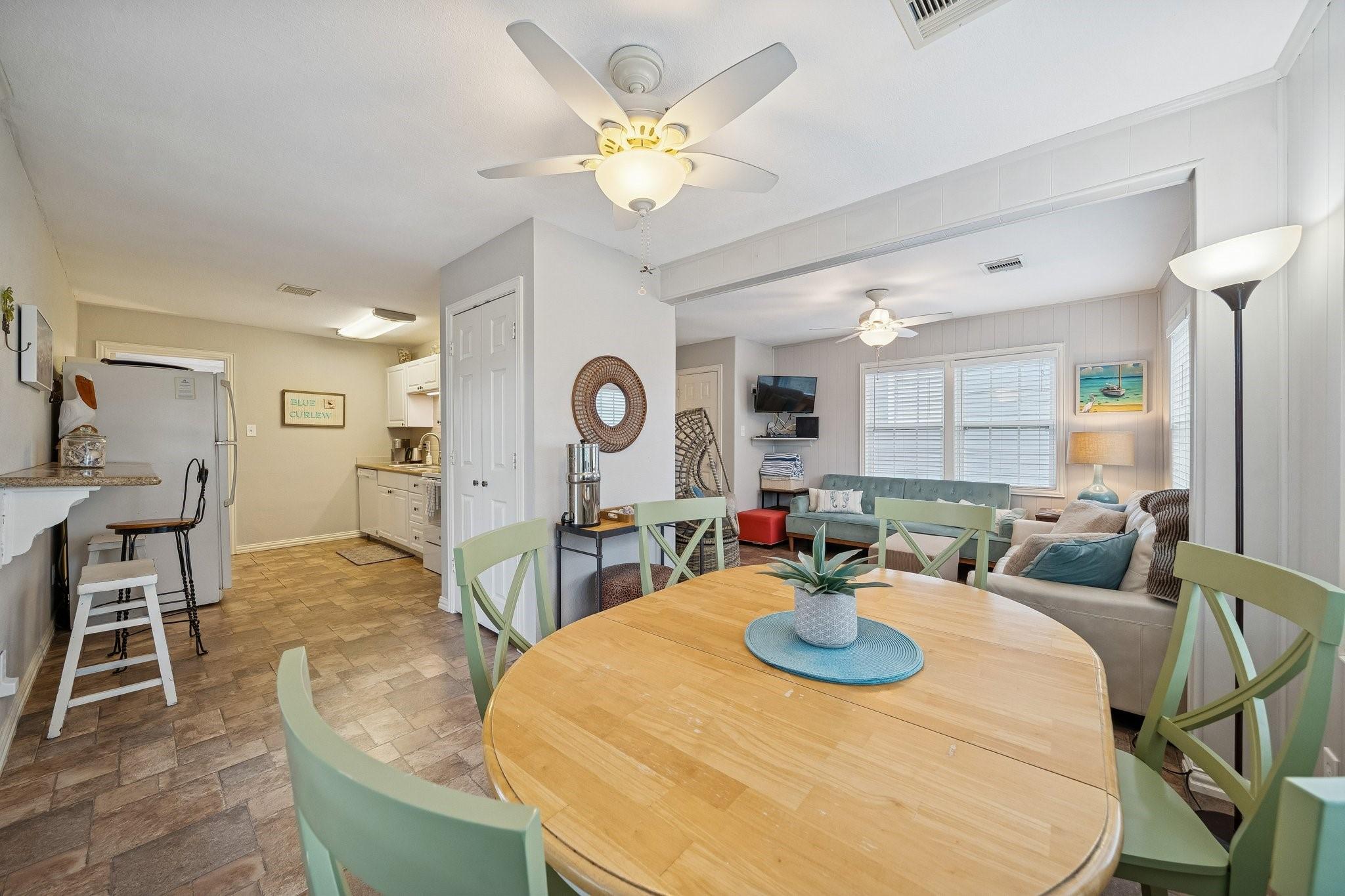 Image 3: Open-concept main living area with the dining spac