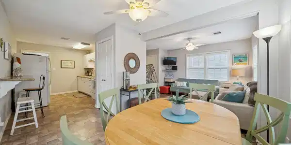 Image 3: Open-concept main living area with the dining spac