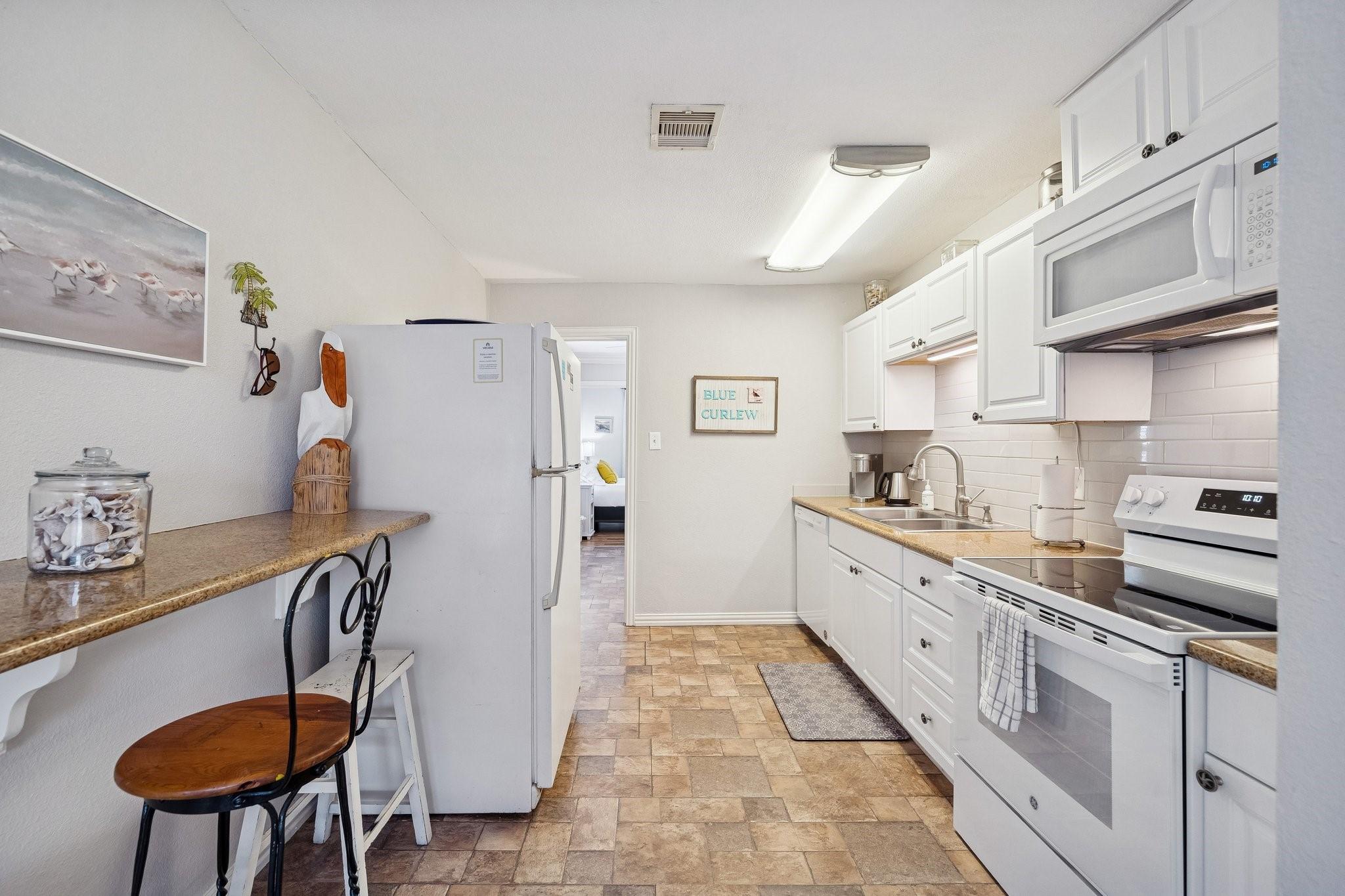 Image 4: Kitchen view highlighting the extended counter spa
