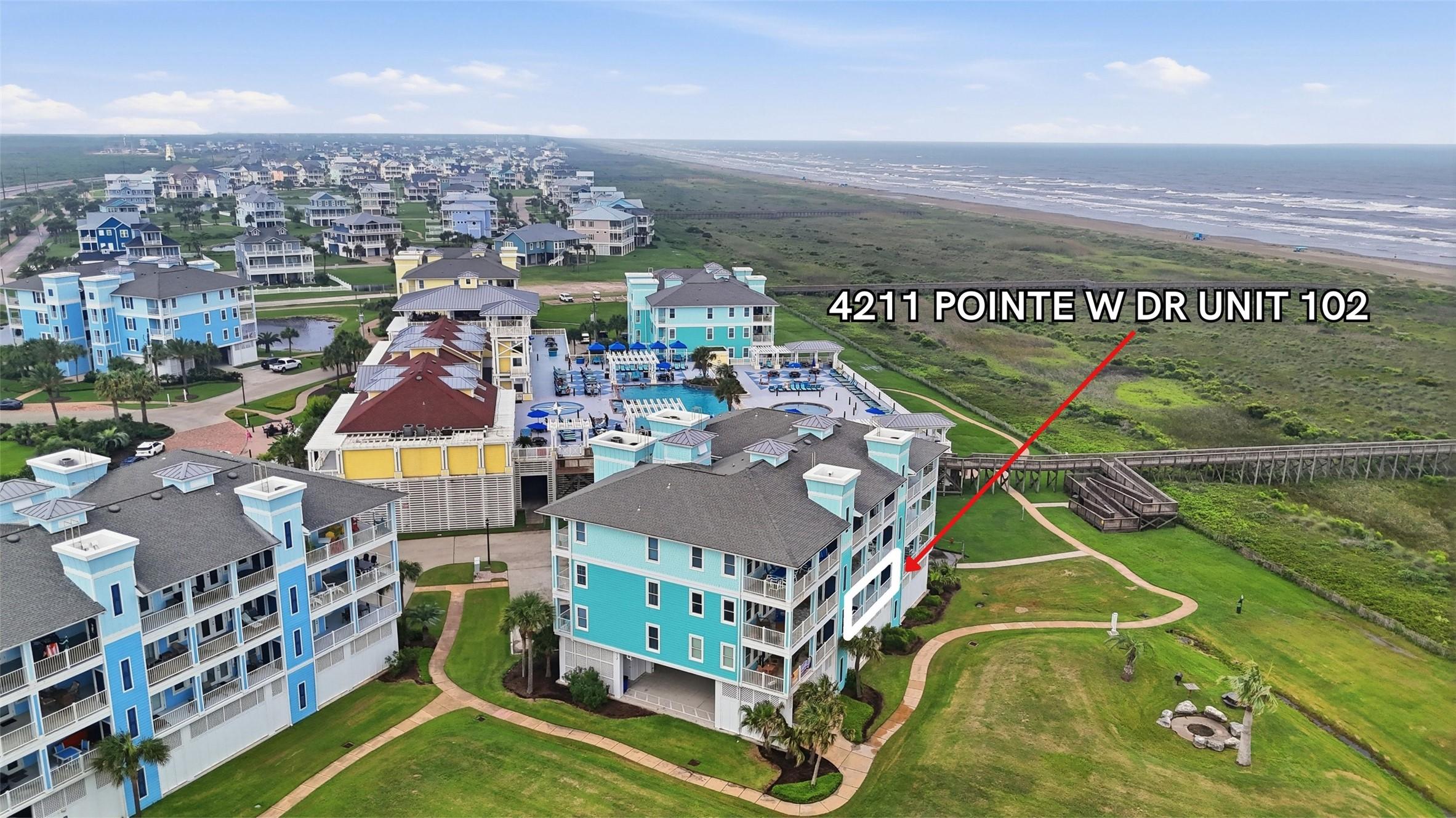 Image 2: Just steps from the sand and surf, this first-floo