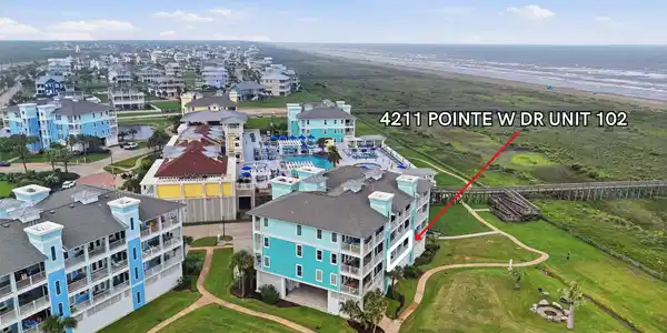 Image 2: Just steps from the sand and surf, this first-floo