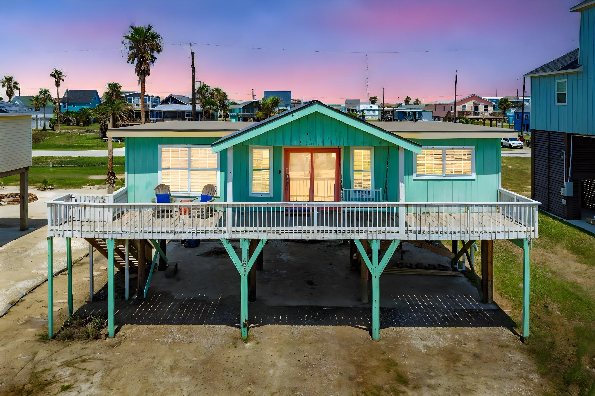 Image 1: Twilight view of 402 Seashell in Surfside Beach.