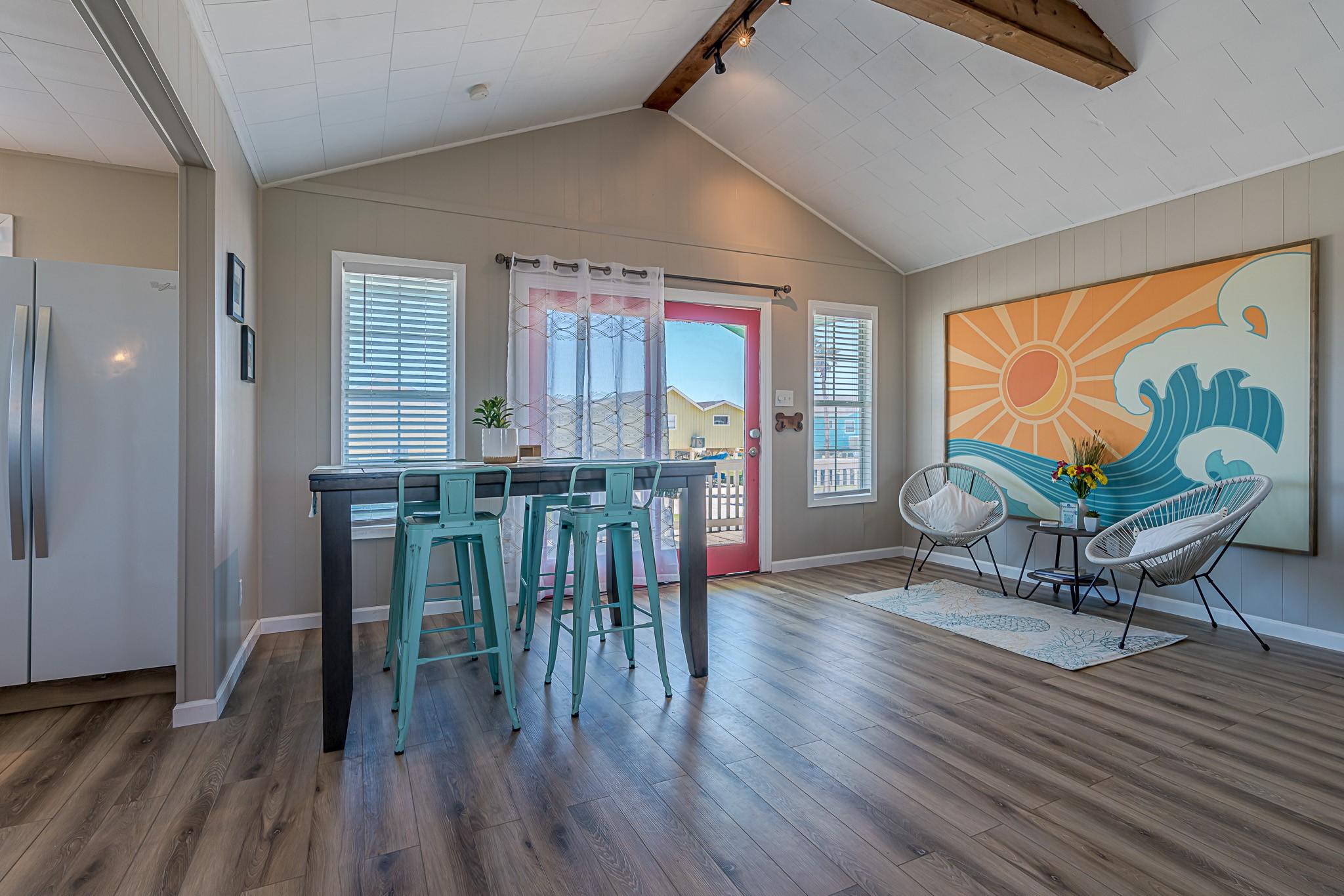 Image 3: Dining Area &ndash; Stylish dining setup with aqua-toned