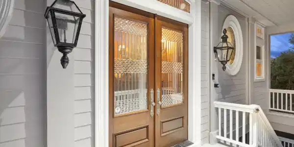 Image 3: Elegant leaded glass  front doors welcome you.