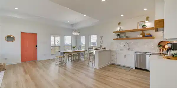 Image 4: Bright open-concept living space filled with natur