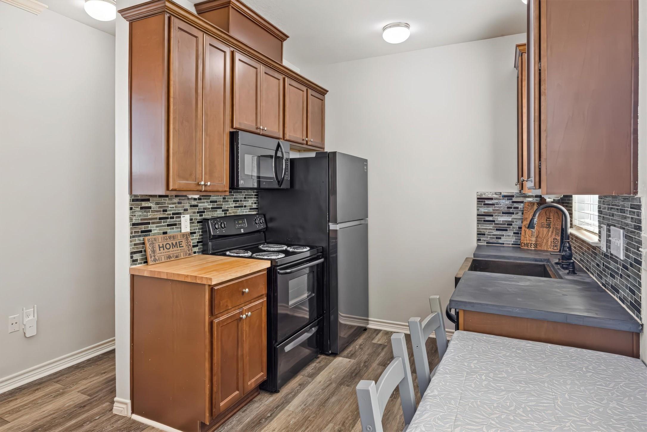 Image 2: This kitchen features modern appliances, including