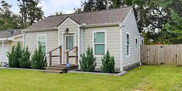 Image 2: Another view of the home&rsquo;s inviting exterior, high