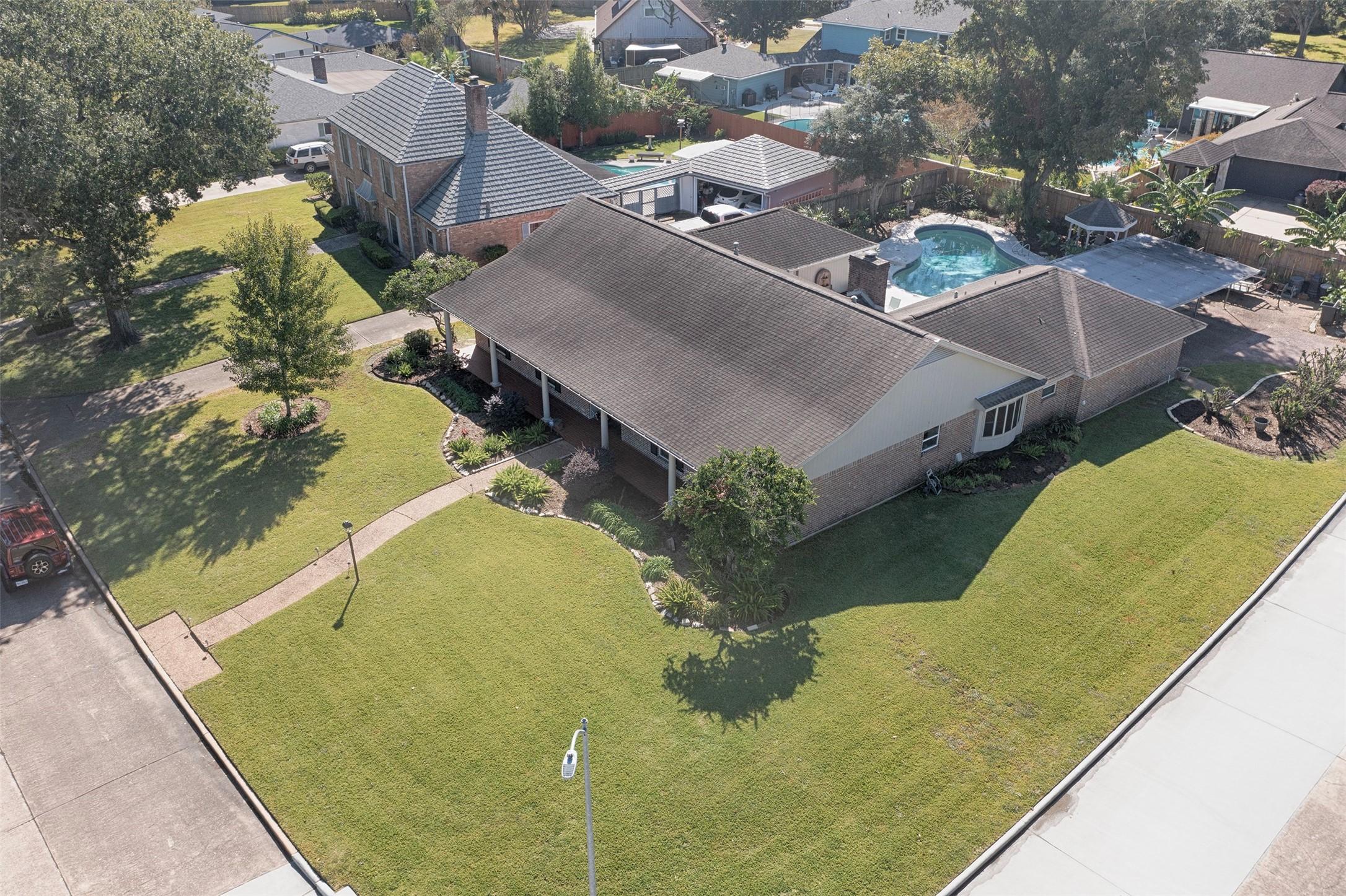 Image 4: An aerial view of the home showing the huge lot an