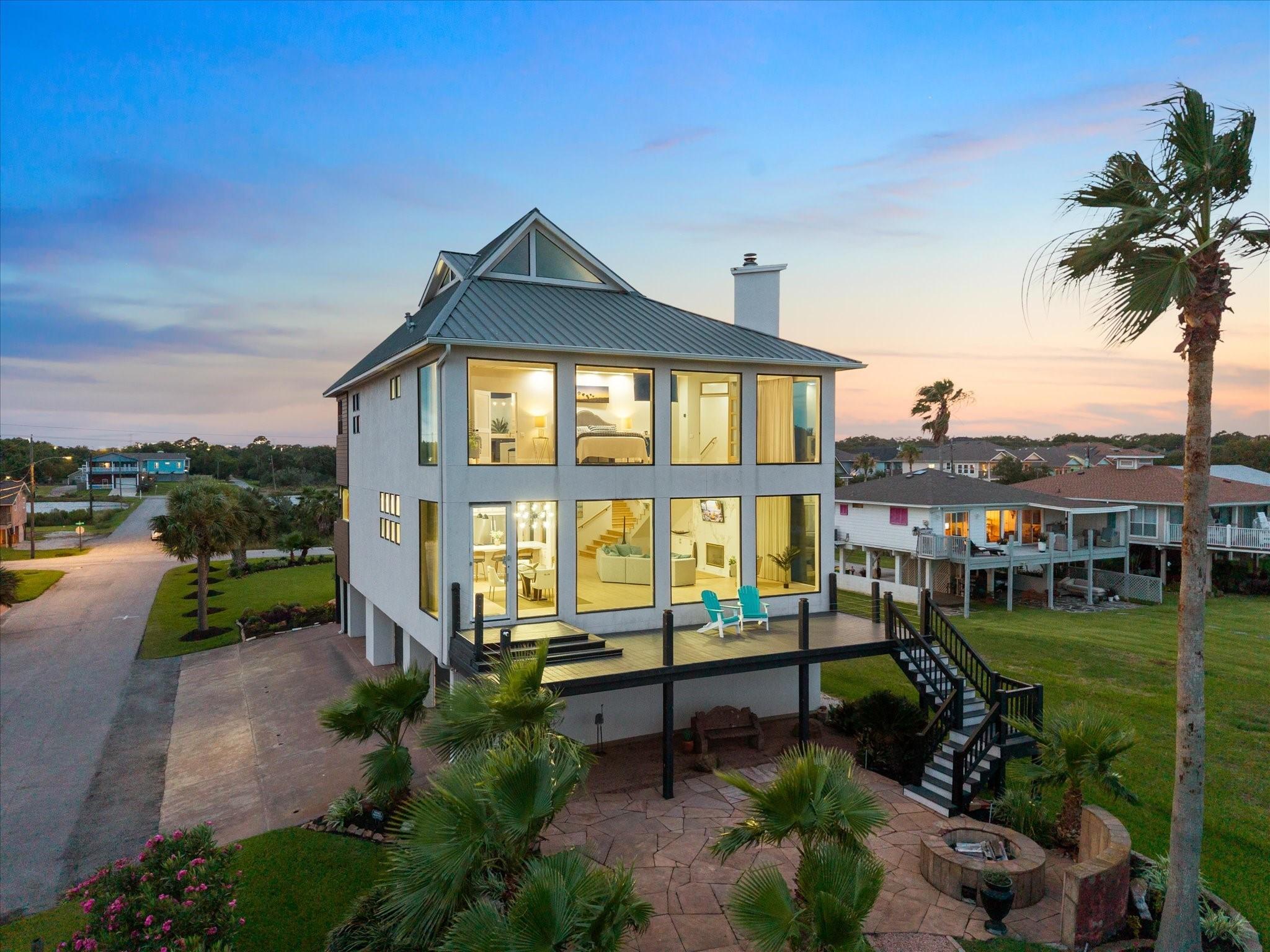 Image 3: ELEVATED REAR AERIAL SHOWCASES THE BALCONY WITH LO