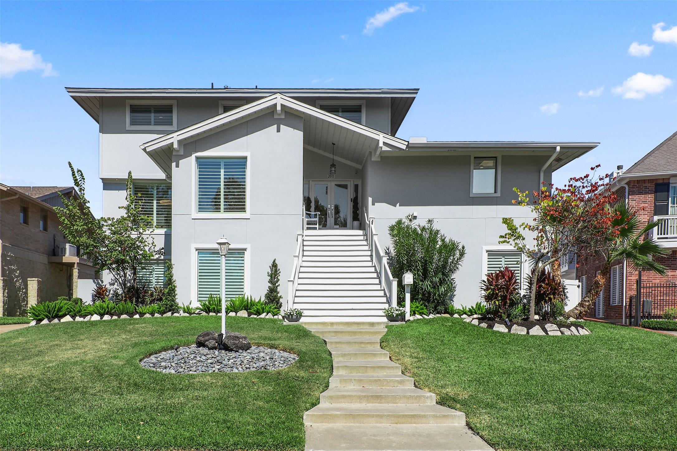 Image 2: This modern stucco home elevated for peace of mind