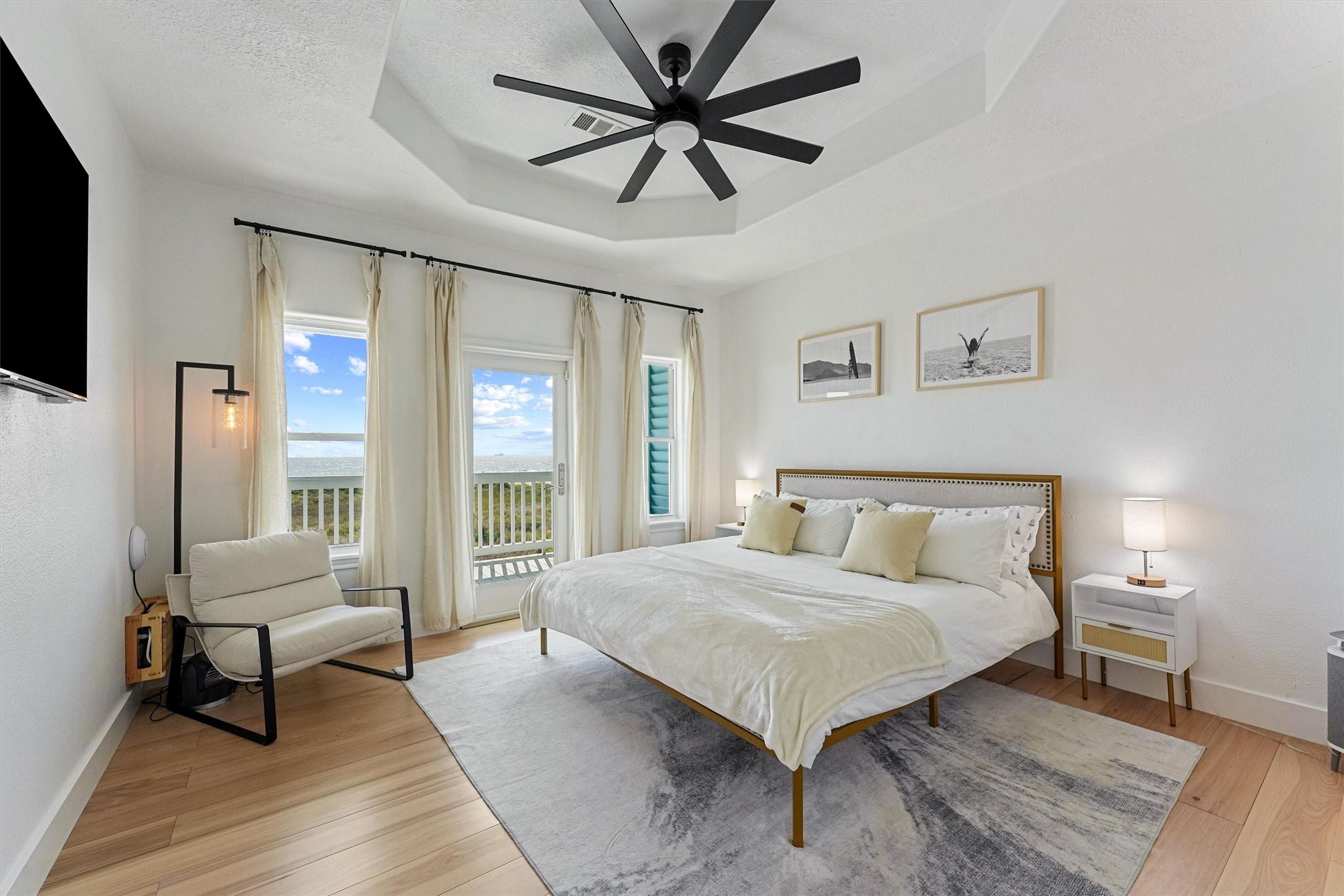 Image 3: Spacious primary bedroom opening directly onto the
