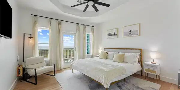 Image 3: Spacious primary bedroom opening directly onto the