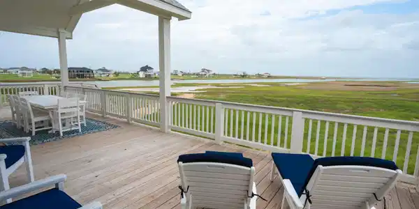 Image 4: Rear balcony with view of West Bay and unobstructe