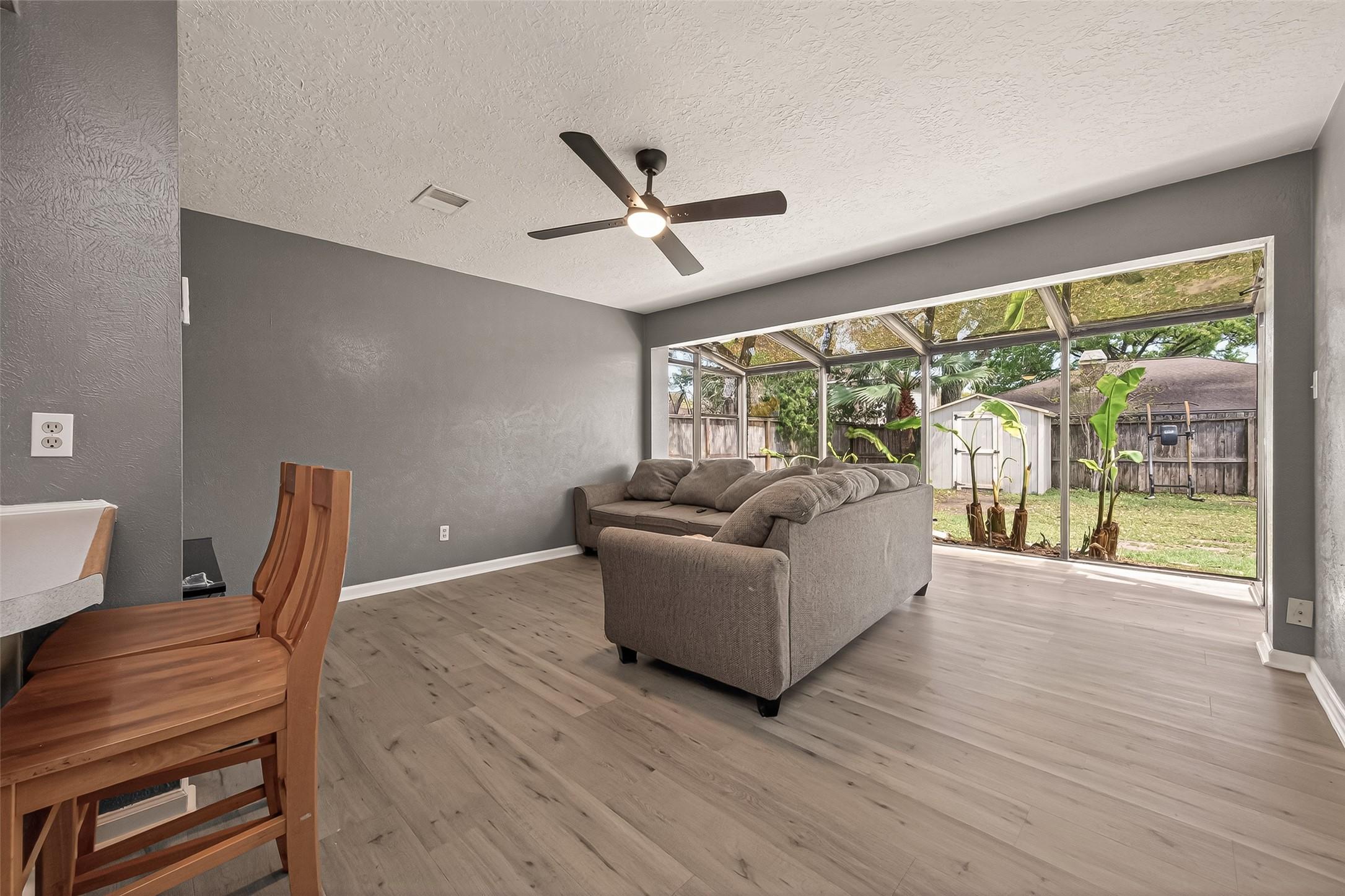 Image 4: Living room with plenty of natural light.