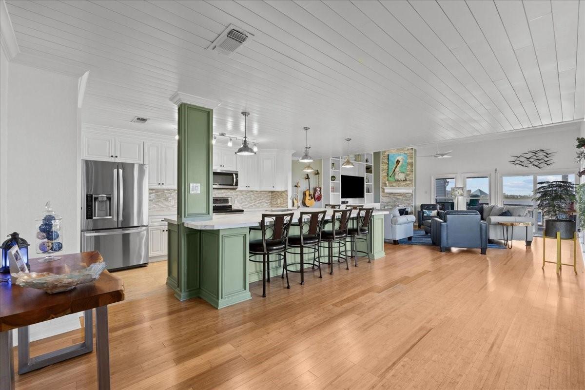 Image 4: Designed for easy coastal living, the open floor p