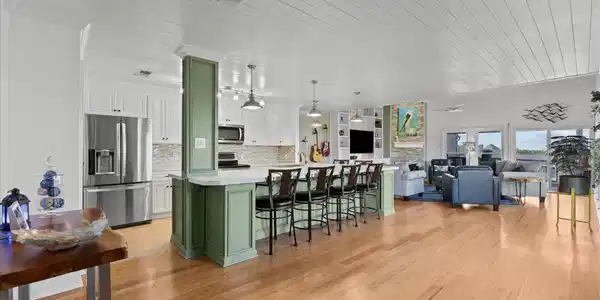 Image 4: Designed for easy coastal living, the open floor p