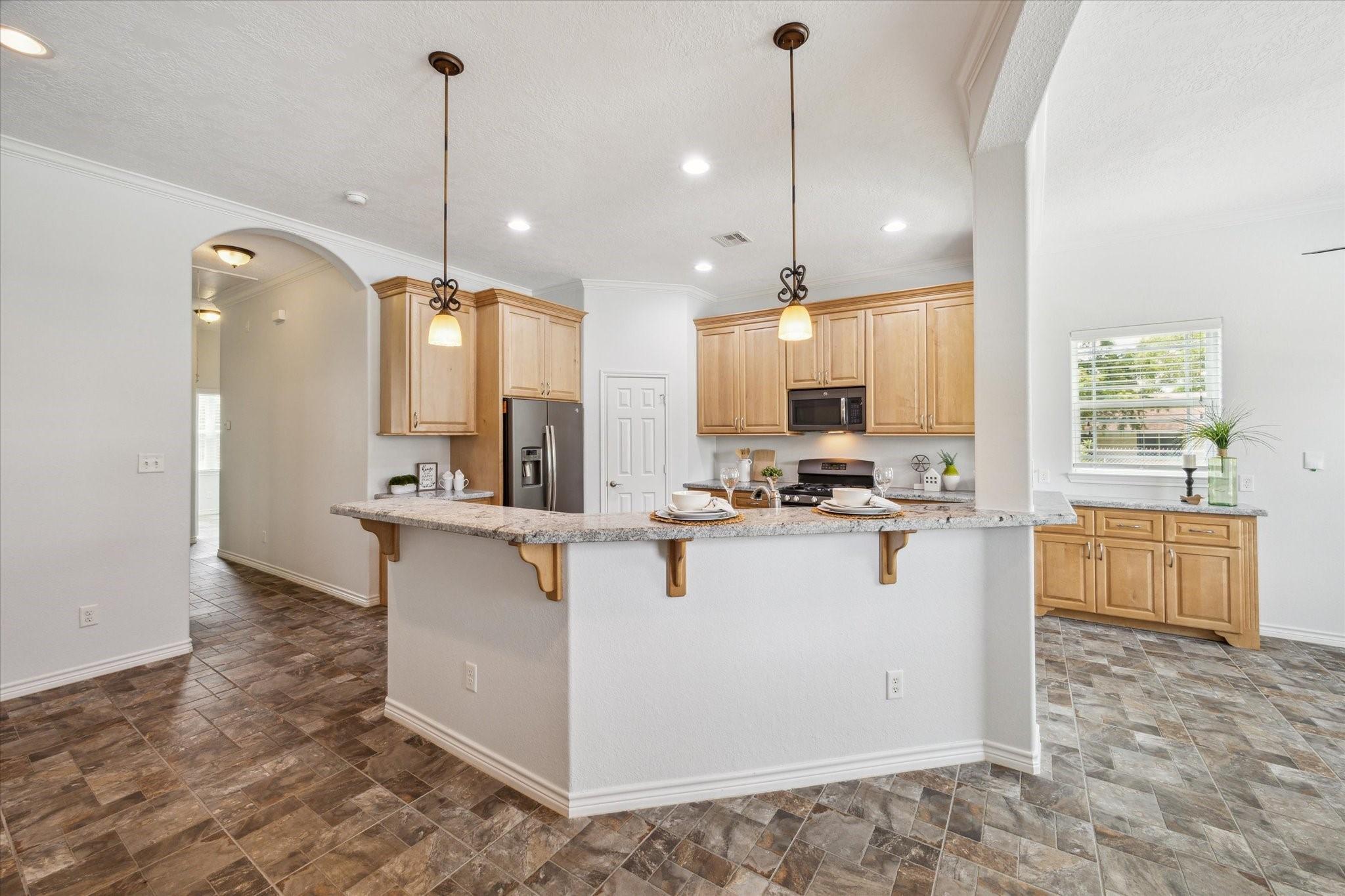 Image 4: Family room open to kitchen and breakfast room