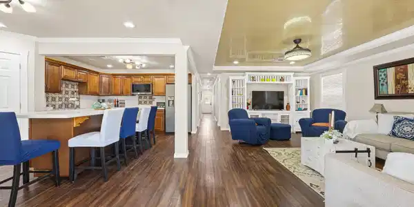 Image 4: Open-concept living area featuring wood-look floor