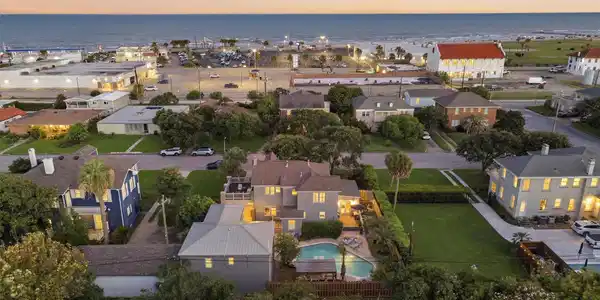 Image 2: Stunning sunset aerial showcasing the resort-style