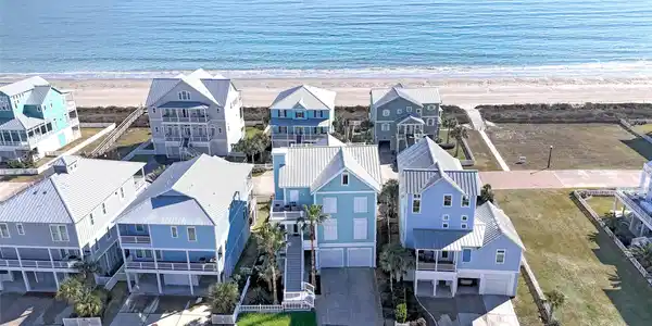 Image 2: Nestled on the second row from the beach, this hom