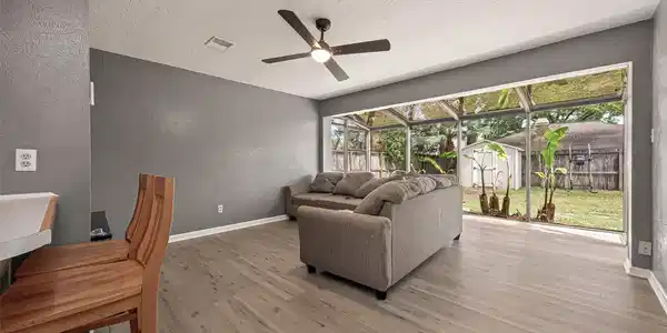 Image 4: Living room with plenty of natural light.
