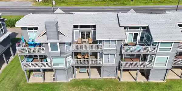 Image 2: The back of the townhome features multiple balconi