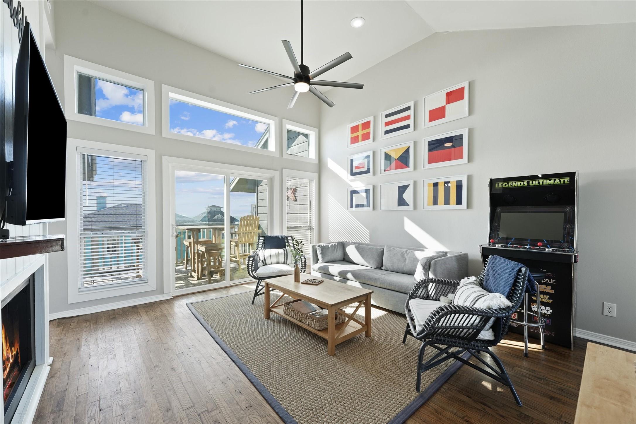 Image 4: This cozy living room boasts a welcoming fireplace