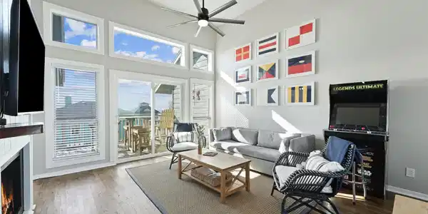 Image 4: This cozy living room boasts a welcoming fireplace