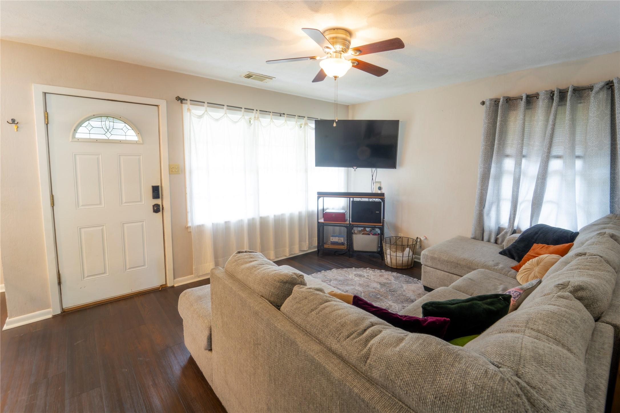 Image 2: living room with lots of natural light
