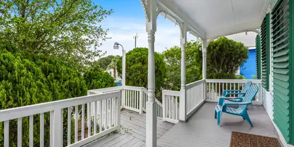 Image 3: Inviting covered front porch featuring classic arc