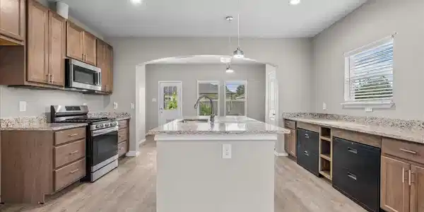 Image 4: Spacious kitchen with oversized island, granite co