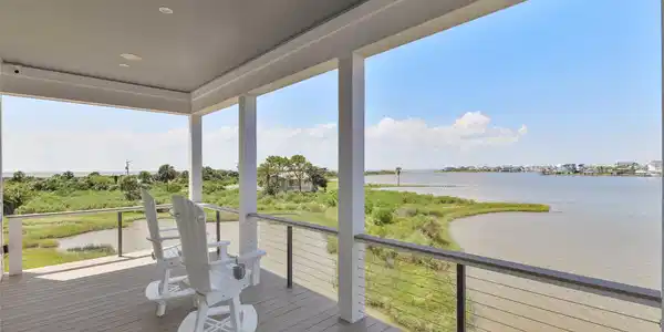 Image 4: Start your day on the first-level deck, where peac