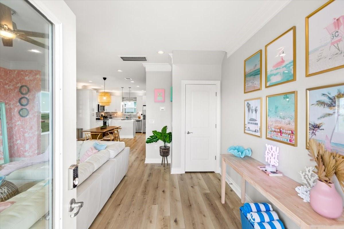 Image 2: Walking in, you find a bright entryway with beauti