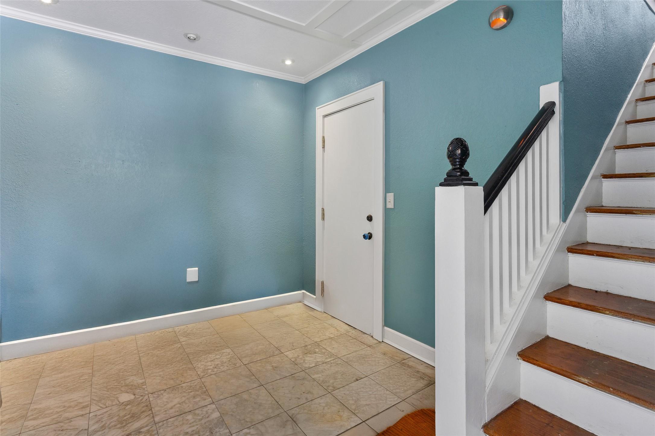 Image 2: This photo shows a welcoming entryway with blue wa