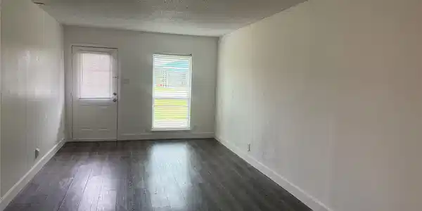 Image 3: The living room is very spacious