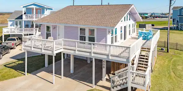 Image 3: Covered parking, a spacious garage, and lots of de