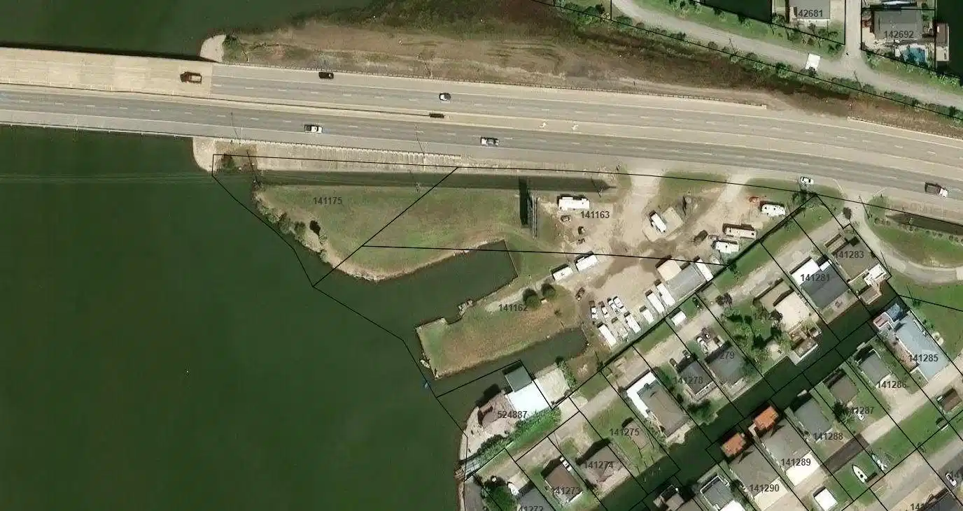 Image 1: This aerial photo shows a residential area near a