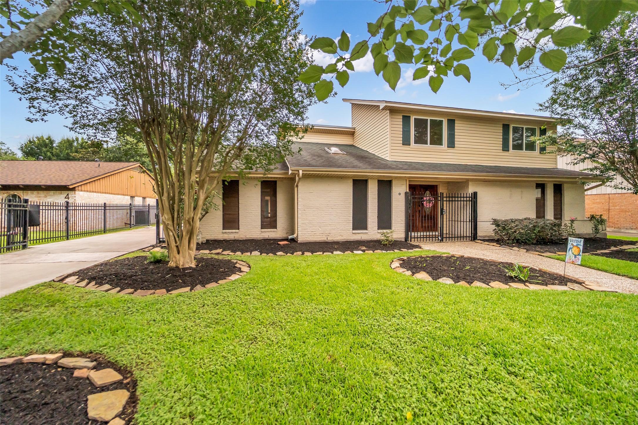 Image 1: Welcome Home! Beautiful landscaping, mature trees,