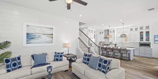Image 4: The shiplap wall in the living room creates a perf
