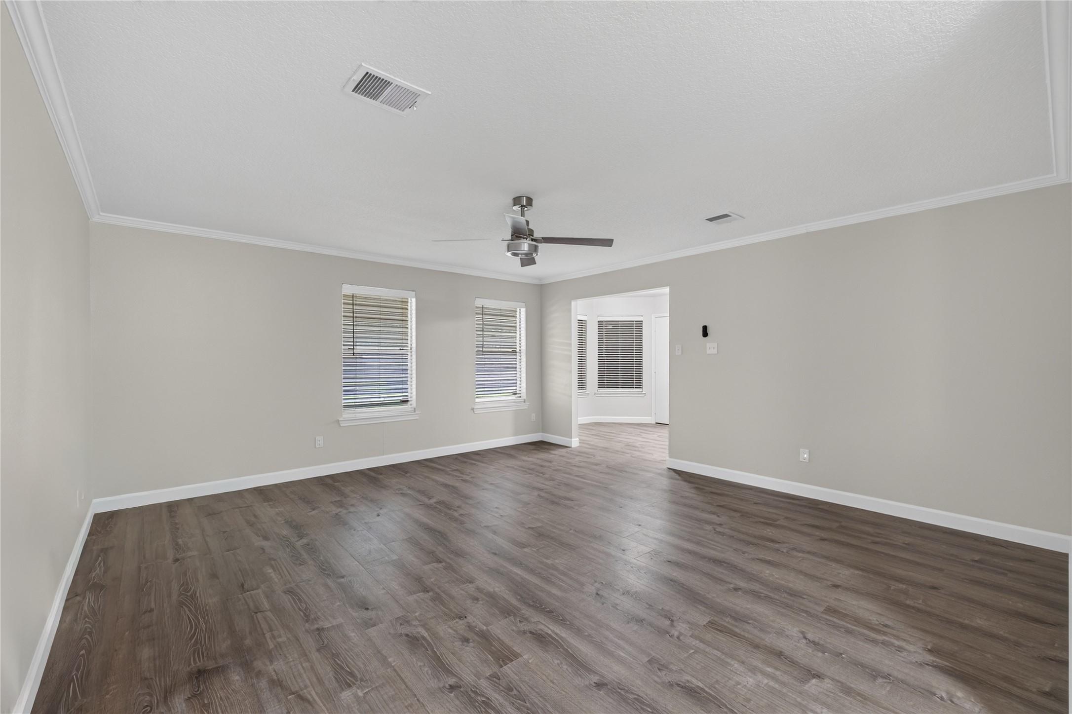 Image 3: Expansive and inviting, this large living room is