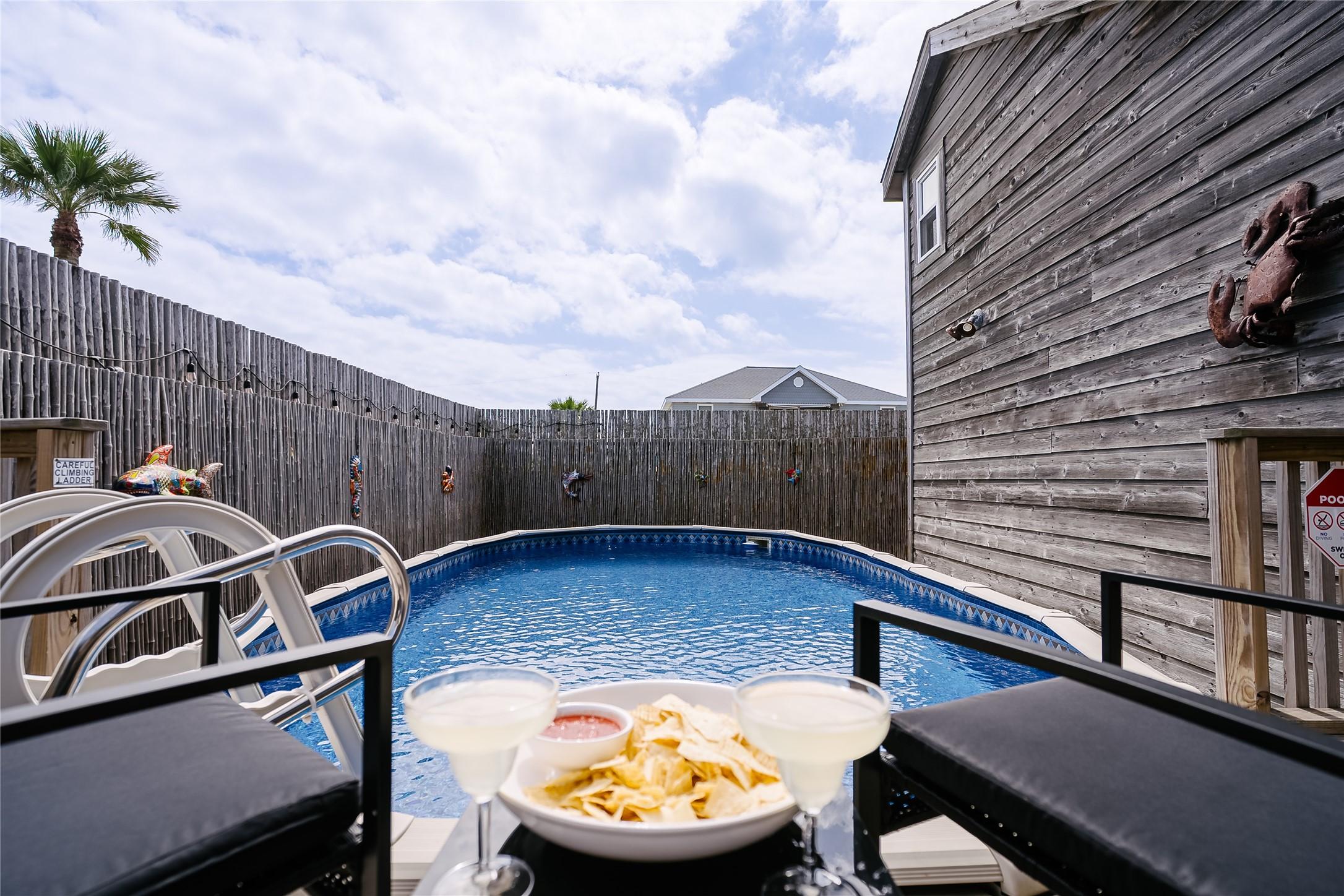 Image 3: This inviting backyard features a private above-gr