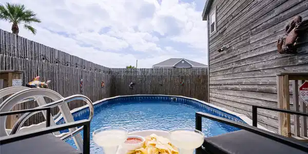 Image 3: This inviting backyard features a private above-gr