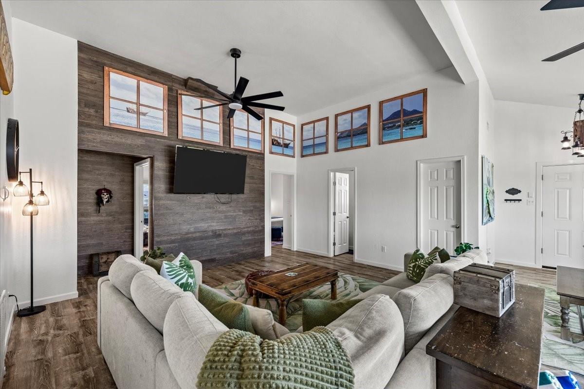 Image 4: This open living area features a modern design wit