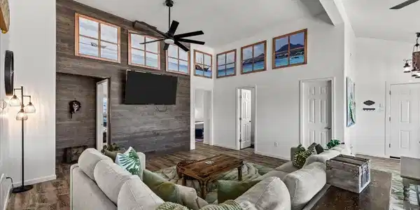 Image 4: This open living area features a modern design wit