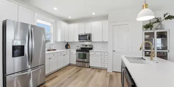 Image 4: Updated kitchen with stainless steel appliances, w