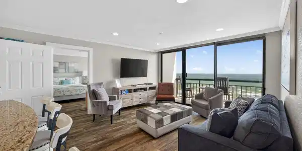 Image 4: Unit 1536 features a bright, open living area with